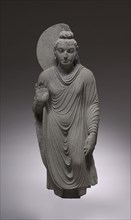 Standing Buddha, 150-200. Pakistan, Gandhara, Kushan Period. Schist; overall: 119.7 cm (47 1/8 in