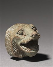 Lion Head, 664-332 BC. Egypt, Late Period, Dyansty 26 or later. Glassy faience; overall: 3 x 2.8 x