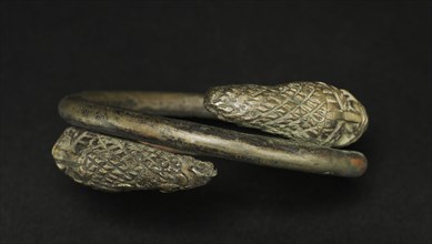 Hand Coil, 1800s. Guinea Coast, Nigeria, Benin, 19th century. Bronze; diameter: 11.5 cm (4 1/2 in.)