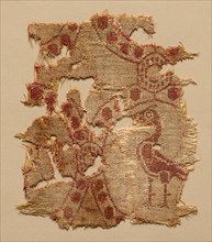 Fragment of roundels with single bird, 700s. Iran, Iraq, or Syria. Samite: wool and cotton;