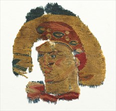Human Head from a Large Curtain, 300s. Egypt, Byzantine period, 4th Century. Tapestry weave, wool;