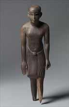 Statuette of a Man, c. 1391-1353 BC. Egypt, New Kingdom, Dynasty 18, reign of Amenhotep III. Ebony