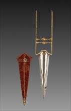 Katar dagger, 1700s. India, Mughal. Iron handle with gold inlay; steel blade; wooden sheath with