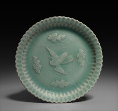 Dish with Flying Crane and Clouds in Relief, 1300s. China, Zhejiang province, Yuan dynasty
