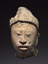 Head from a Building's Façade, 250-900. Mexico, Campeche, Maya style (250-900). Stucco, paint;