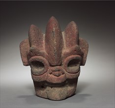 Head Hacha, 300-900. Mexico, Veracruz. Gray volcanic stone with red pigment; overall: 19.5 x 17.2 x