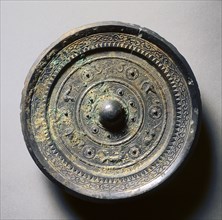 Mirror with Concentric Circles, an Immortal, and Auspicious Animals, 1st century. China, Eastern