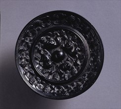 Animal-and-Grape Mirror, mid 600s. China, Tang dynasty (618-907). Bronze; diameter: 8.2 cm (3 1/4