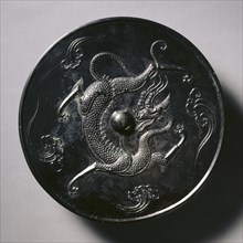 Mirror with a Coiling Dragon, 700s. China, Tang dynasty (618-907). Bronze; diameter: 10.2 cm (4 in