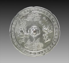 Lobed Mirror with a Tortoise Knob, a Musician, and a Phoenix, late 700s. China, Tang dynasty
