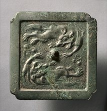 Cruciform Mirror with Two Lions, late 8th-early 9th century. China, Tang dynasty (618-907). Bronze;
