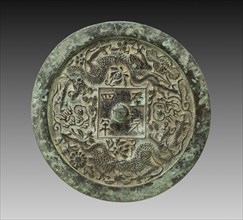 Mirror with Twin Dragons and Lotus Blossoms, 1338. China, Shanxi province, Hezhong, Yuan dynasty