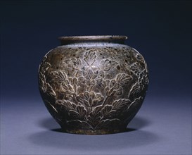 Jar with Floral Decoration, c. 700-750. China, Tang dynasty (618-907). Stone; diameter: 13.3 cm (5