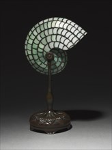 Desk Lamp, c. 1900. Studio of Louis Comfort Tiffany (American, 1848-1933). Bronze, leaded glass;