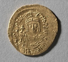 Solidus of Maurice Tiberius, 583-602. Byzantine, 6th-7th century. Gold; diameter: 2.2 cm (7/8 in.)