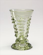 Footed Beaker; Lower Rhineland, possibly, Germany; 1500 - 1550; Free-blown pale yellow-green glass with applied decoration