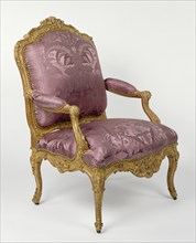 Armchair; Paris, France; about 1730 - 1735; Gessoed and gilded beech; brass casters; modern silk upholstery; 108.5 x 72.3 x 63.4