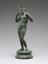 Statuette of Venus on Round Base; Asia Minor, ?, 1st century A.D; Bronze; 17 × 6.4 × 6.4 cm, 6 11,16 × 2 1,2 × 2 1,2 in