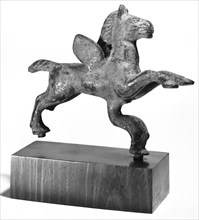 Furniture Support of Pegasus with Dolphin; Roman Empire; 2nd - 3rd century; Bronze; 10 × 12.3 cm, 3 15,16 × 4 13,16 in