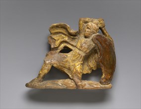 Relief with a Fighting Arimasp; Tarentum, Taras, South Italy; 350 - 300 B.C; Terracotta with yellowish slip and foil gilding