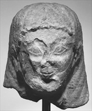 Head from a Statue of a Male Figure; about 540 B.C; Limestone; 29.8 × 20 × 21 cm, 11 3,4 × 7 7,8 × 8 1,4 in