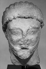 Head from a Statue of a Male Figure; about 500 B.C; Limestone; 29.5 × 19.5 × 14 cm, 11 5,8 × 7 11,16 × 5 1,2 in