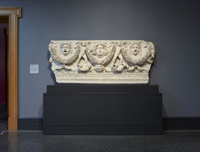 Front Panel of a Garland Sarcophagus; Roman Empire; about A.D. 140–170; Light gray marble, Phrygian marble, 91.5 × 226 × 18.5