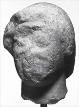 Head of a Kouros; Greece; about 510 B.C; Marble; 18.7 × 13.5 × 14.3 cm, 7 3,8 × 5 5,16 × 5 5,8 in
