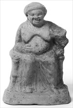 Statuette of Seated Old Woman; North Africa, ?, 3rd–1st century B.C; Terracotta with traces of white slip; 16.5 cm, 6 1,2 in