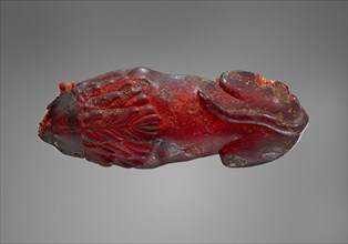 Pendant: Lion; Italy; 525 - 480 B.C; Amber; 105 × 40 × 18 mm, 35.5 g, 4 1,8 × 1 9,16 × 11,16 in., 0.0783 lb