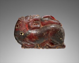 Pendant: Lion with Bird; Italy; 600 - 550 B.C; Amber; 42 × 60 × 15 mm, 1 5,8 × 2 3,8 × 9,16 in