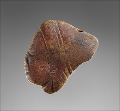 Pendant: Female Head in Profile; Italy; 500 - 480 B.C; Amber; 44 × 38 × 16 mm, 1 3,4 × 1 1,2 × 5,8 in