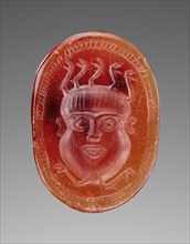 Engraved Scarab with Head of a Gorgon; about 500 B.C; Carnelian; 0.8 × 1.6 × 1.2 cm, 5,16 × 5,8 × 1,2 in