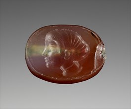Engraved Scaraboid; 480 - 470 B.C; Carnelian with clear patches; 0.4 × 1 × 0.7 cm, 3,16 × 3,8 × 1,4 in