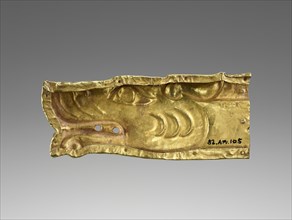 Applique in the shape of a wolf head worked in repousse; Eastern Hellenistic Empire; 100 B.C.–A.D. 50; Gold; 4.1 × 10.5 × 2.5 cm