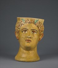 Mug Shaped as the Head of a God; Likinnios, Greek, active 100 - 1 B.C., Asia Minor; 1st century B.C; Terracotta; 19 × 12.2 cm