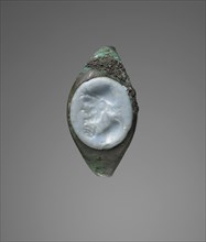 Molded Gem Inset Into Fragmentary Ring; Roman Empire; second half of 1st century B.C; Gem: pale blue opaque glass; ring: bronze