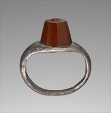 Engraved Gem Inset Into A Ring; 3rd century; Gem: red jasper; ring: silver; 0.9 × 0.7 × 0.7 cm, 5,16 × 5,16 × 1,4 in