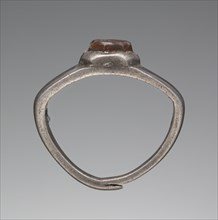 Engraved Gem Inset Into A Ring; 3rd century; Gem: carnelian; ring: silver; 0.7 × 0.6 × 0.3 cm, 1,4 × 3,16 × 1,8 in