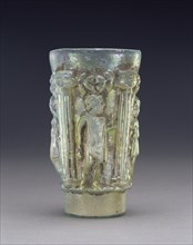 Beaker with Mythological Figures; Eastern Mediterranean; third quarter of 1st century; Glass; 12.6 × 7 cm, 4 15,16 × 2 3,4 in