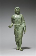 Votive Statuette of a Young Man; Etruria; about 490 B.C; Bronze; 22.5 × 9 cm, 8 7,8 × 3 9,16 in