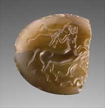 Engraved Scaraboid; first quarter of 4th century B.C; Brown chalcedony; 4.2 × 3.8 × 1.3 cm, 1 5,8 × 1 1,2 × 1,2 in