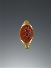 Engraved Gem Set Into a Ring; 2nd century; Gem: red jasper; ring: gold; 1.3 × 1.9 cm, 1,2 × 3,4 in