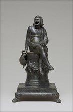 Incense Burner Shaped as a Comic Actor Seated on an Altar; Roman Empire; first half of 1st century; Bronze with silver inlay