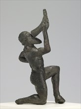 Statuette of a Kneeling Satyr; Greece; 480 - 460 B.C; Bronze; 9.8 × 4.1 × 5.4 cm, 3 7,8 × 1 5,8 × 2 1,8 in