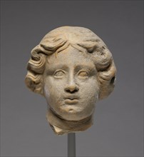 Head of a Woman; Tarentum, Taras, South Italy; 350 - 300 B.C; Terracotta; 12 × 10.3 cm, 4 3,4 × 4 1,16 in