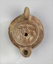 Lamp; Roman Empire; 2nd - 3rd century; Terracotta; 4.3 x 6.9 x 9.5 cm, 1 11,16 x 2 11,16 x 3 3,4 in