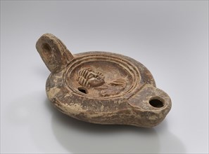 Lamp; North Africa, Tunisia; 1st - 2nd century; Terracotta; 11 x 3.9 x 7.3 cm, 4 5,16 x 1 9,16 x 2 7,8 in
