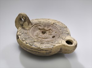 Lamp; North Africa, Tunisia; 2nd century; Terracotta; 10.9 x 4.6 x 7.6 cm, 4 5,16 x 1 13,16 x 3 in