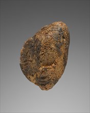 Pendant: Female Head; Italy; 425 - 400 B.C; Amber; 29 × 38 × 14 mm, 1 1,8 × 1 1,2 × 9,16 in